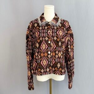 Eye catching printed statement jacket with rich boho inspired geometric patterns